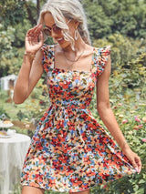 Vestido Modelo Acinturado Rodado Curto Estampa Floral Costas Nuas com Laço Alça de Babado