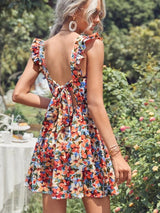 Vestido Modelo Acinturado Rodado Curto Estampa Floral Costas Nuas com Laço Alça de Babado