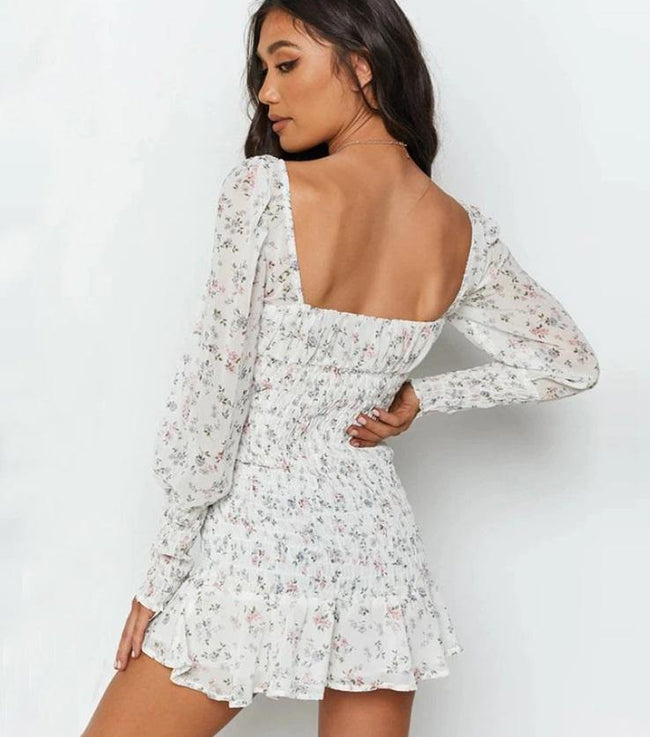 vestido curto branco floral acinturado manga longa decotado 